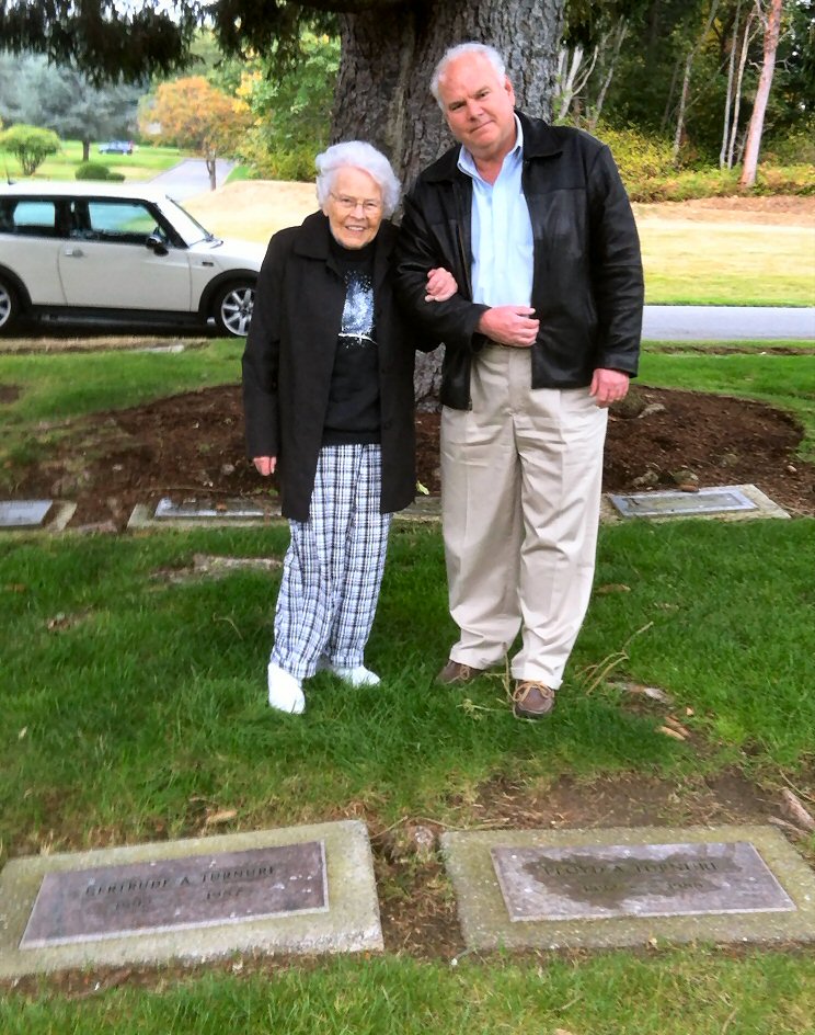 Doris and Andy at markers for Doris' parents