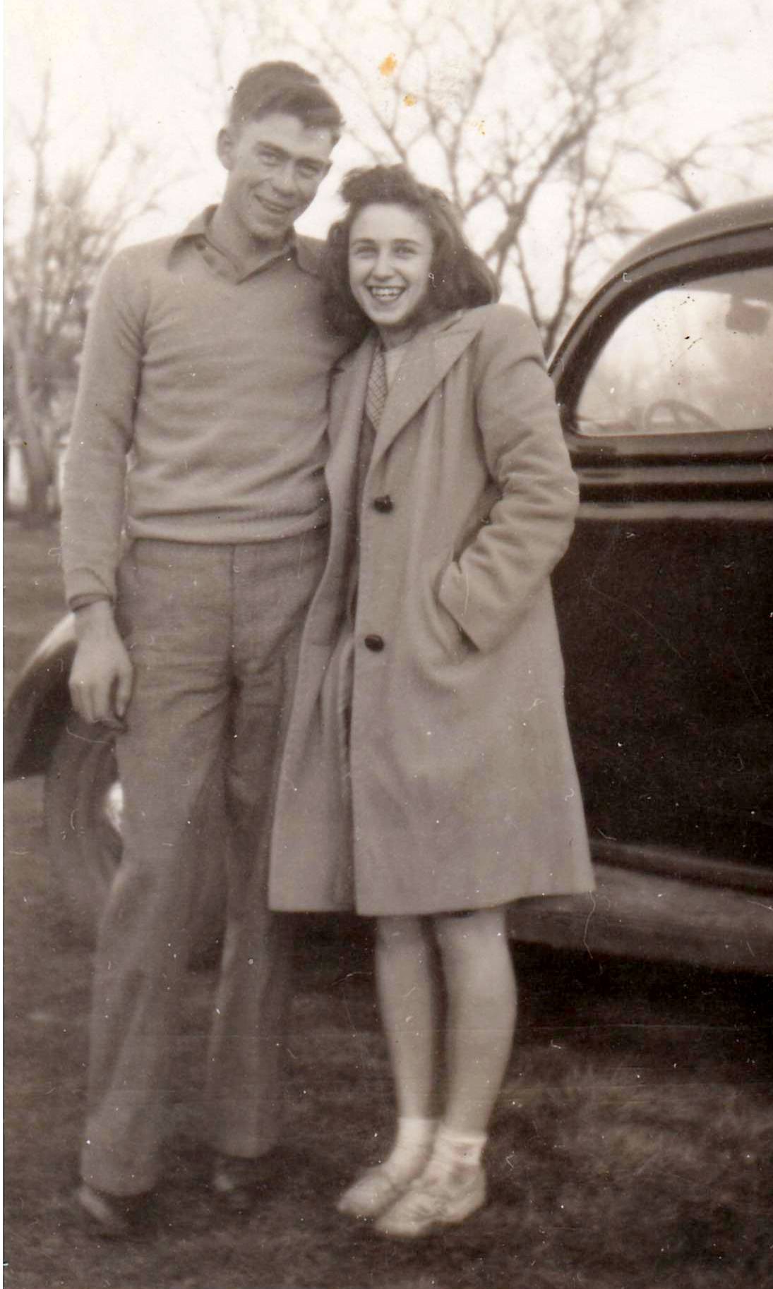 Bob & Pat w/ car at St Ed's HighSchool